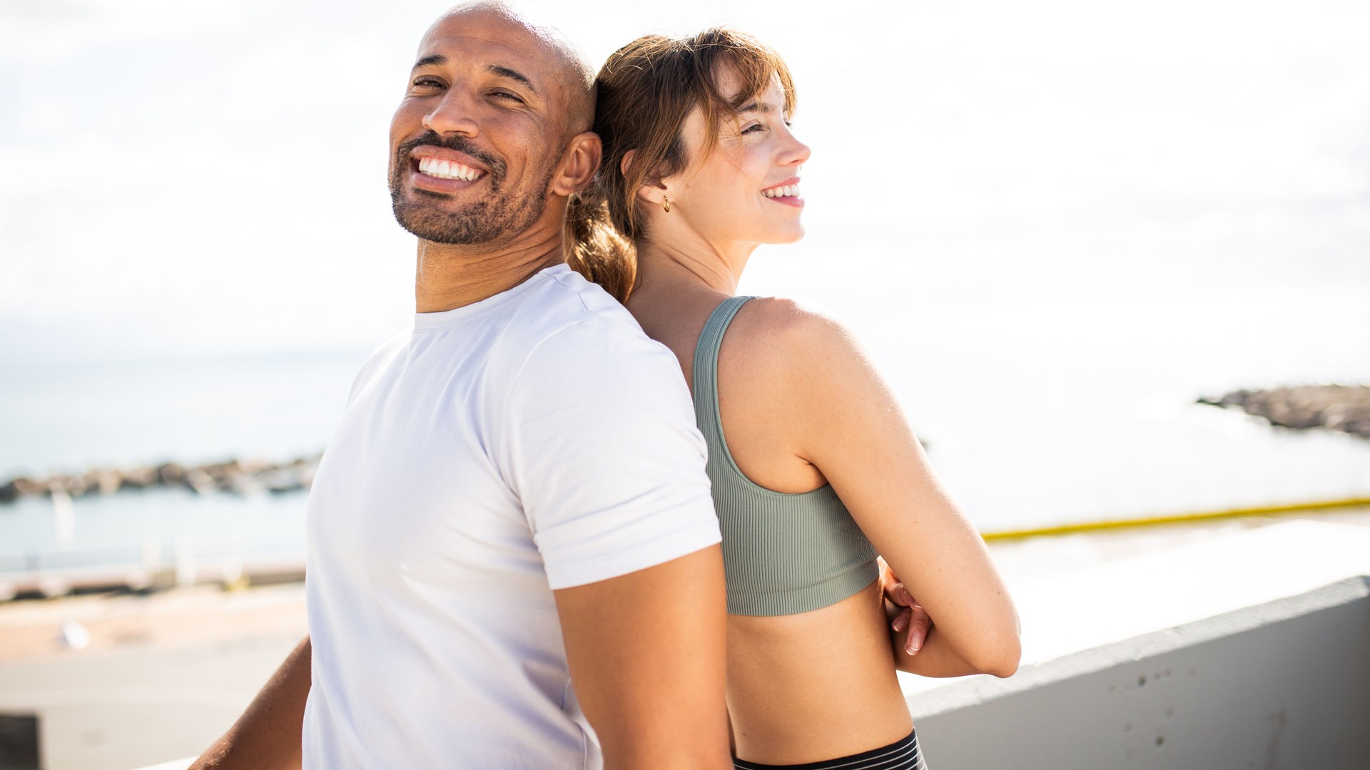 Fitness Duo Smiling Back-to-Back