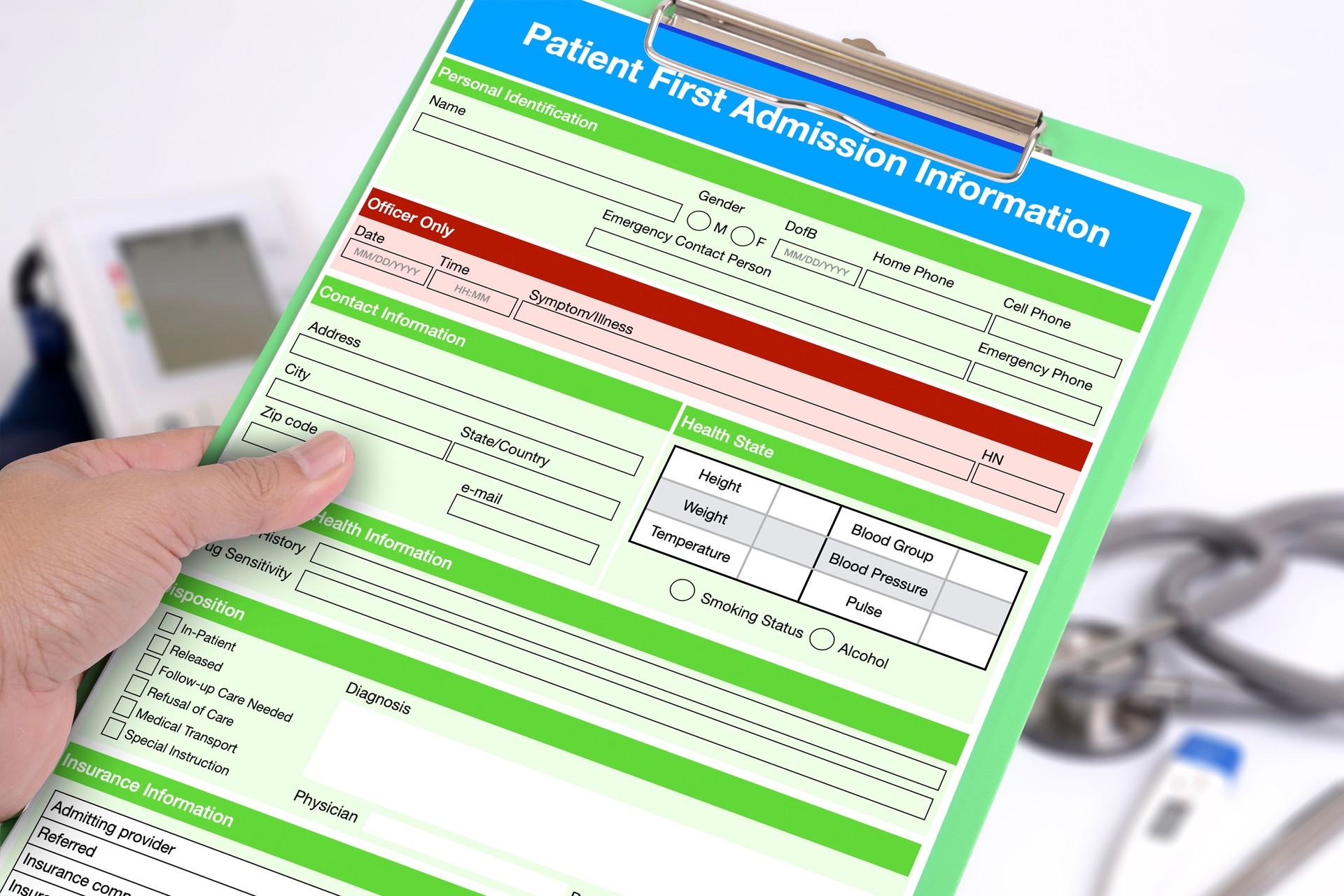 Hand holding clipboard with blank patient first admission form.