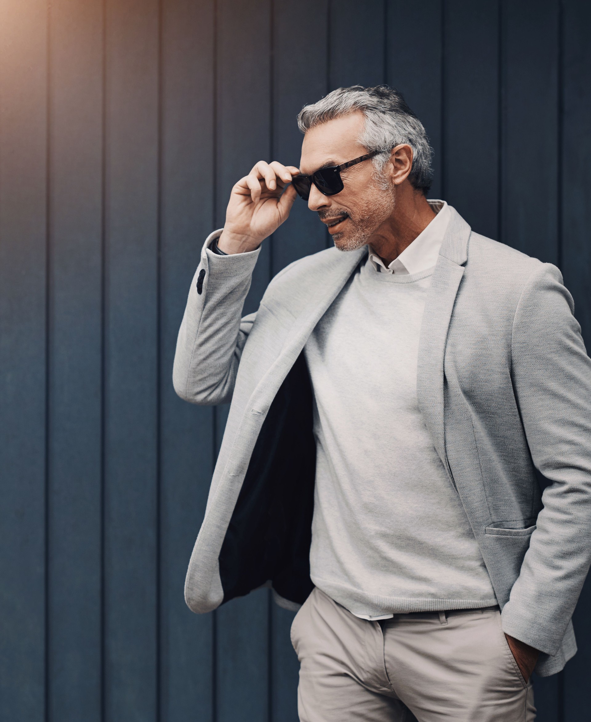 Business fashion, sunglasses and mature man in city with confidence, style and luxury by building space. Male professional, wealth or future on wall street in finance, management or corporate success